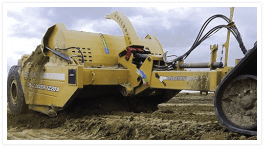 Pulldozer 1220A scraper operating in mud