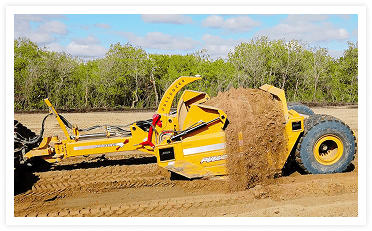 Pulldozer scraper ejecting dirt