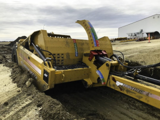 Bridgeview - Pulldozer 1220A scraper digging culvert