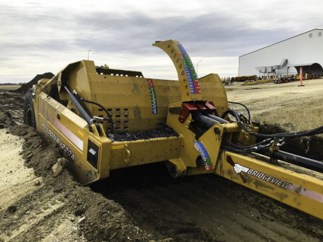 Bridgeview - Pulldozer 1220A scraper digging culvert