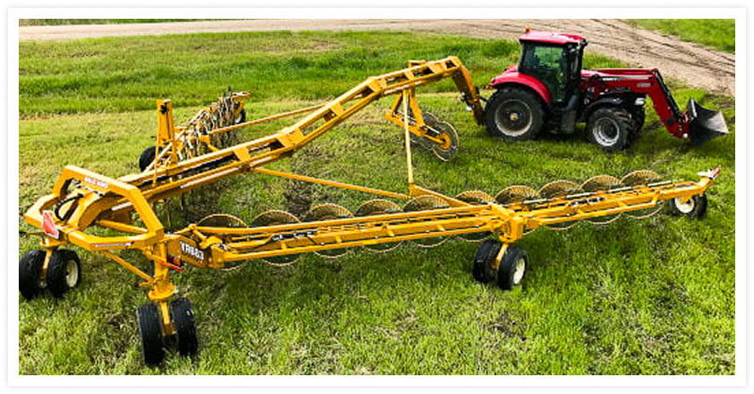 Carted wheel rake in hay field